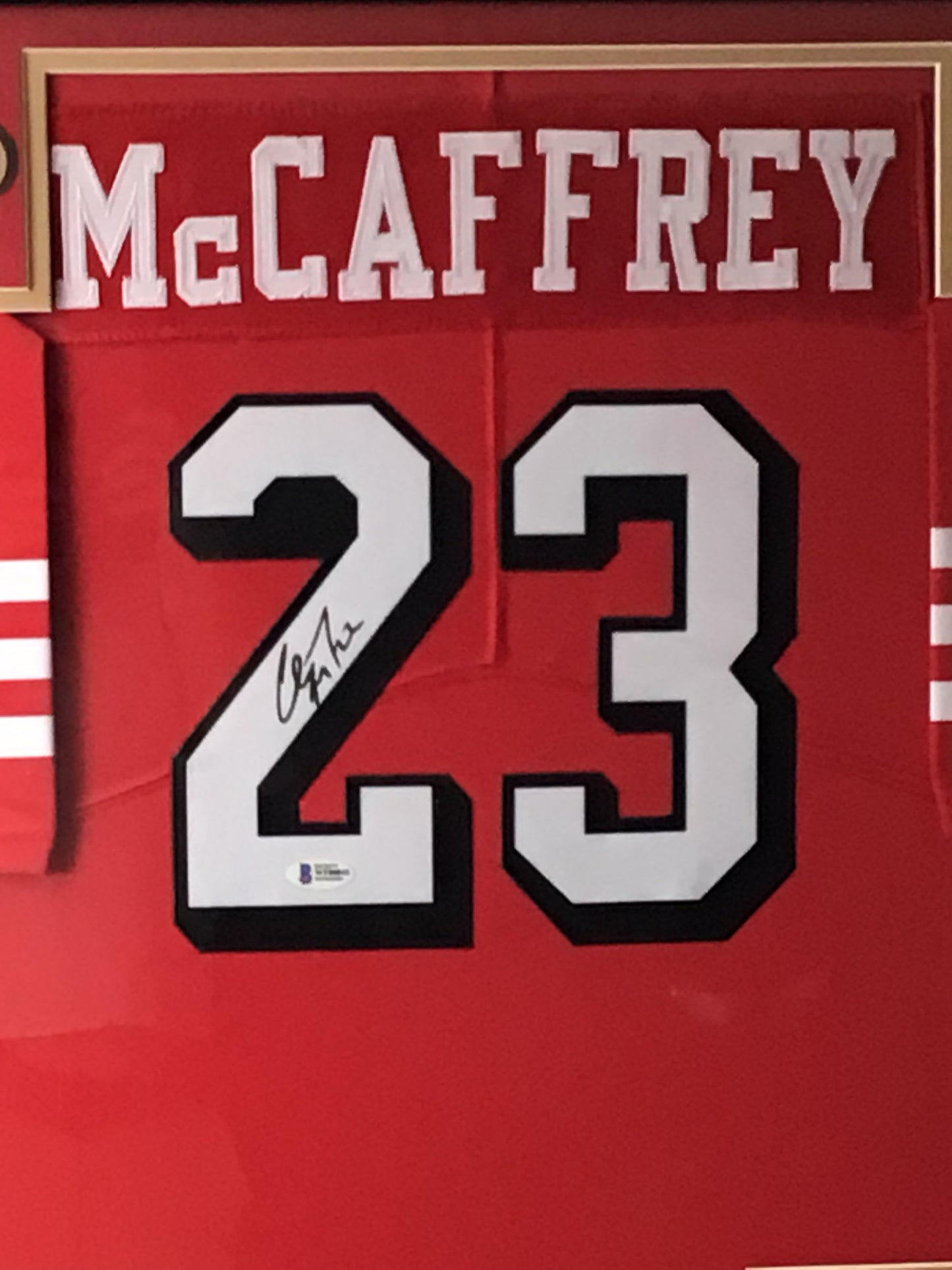 Framed Christian McCaffrey Autographed Jersey w/ Beckett Authentication & Sports Card