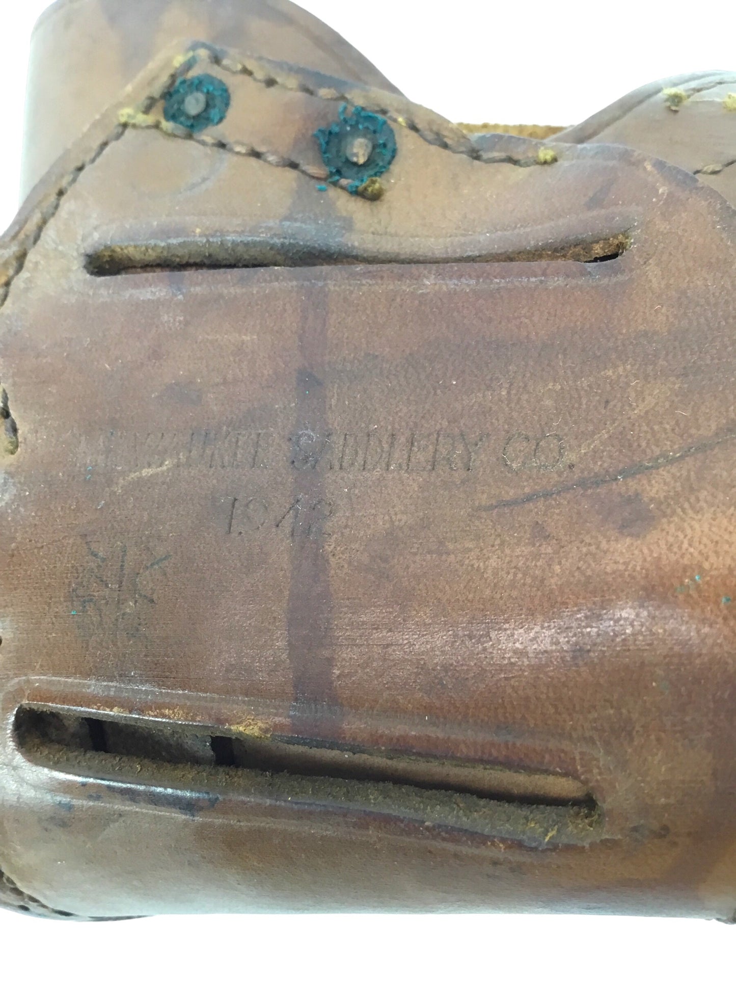 U.S. WWII leather pistol holster marked "U.S." on flap, further marked "Milwaukee Saddlery Co., 1942"
