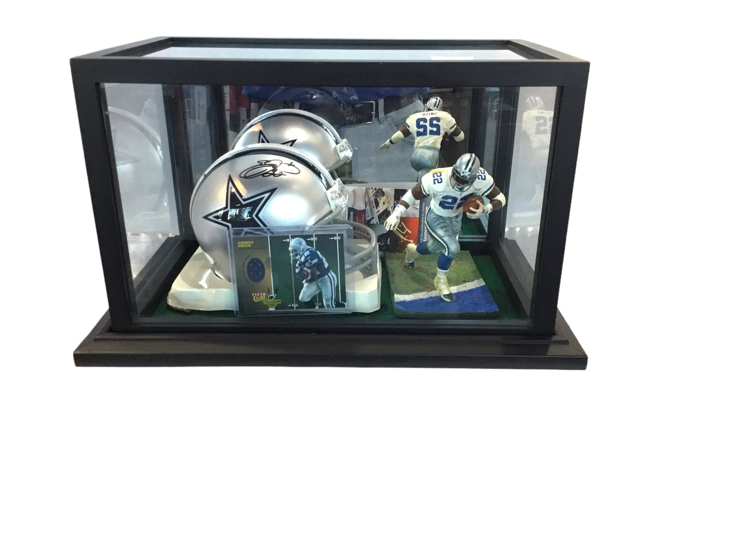 Emmitt Smith Dallas Cowboys Certified Authentic Autographed Mini-helmet with a collectible 2003 fleer Ultra game worn jersey card and action figure in a Shadowbox display case. Certified by