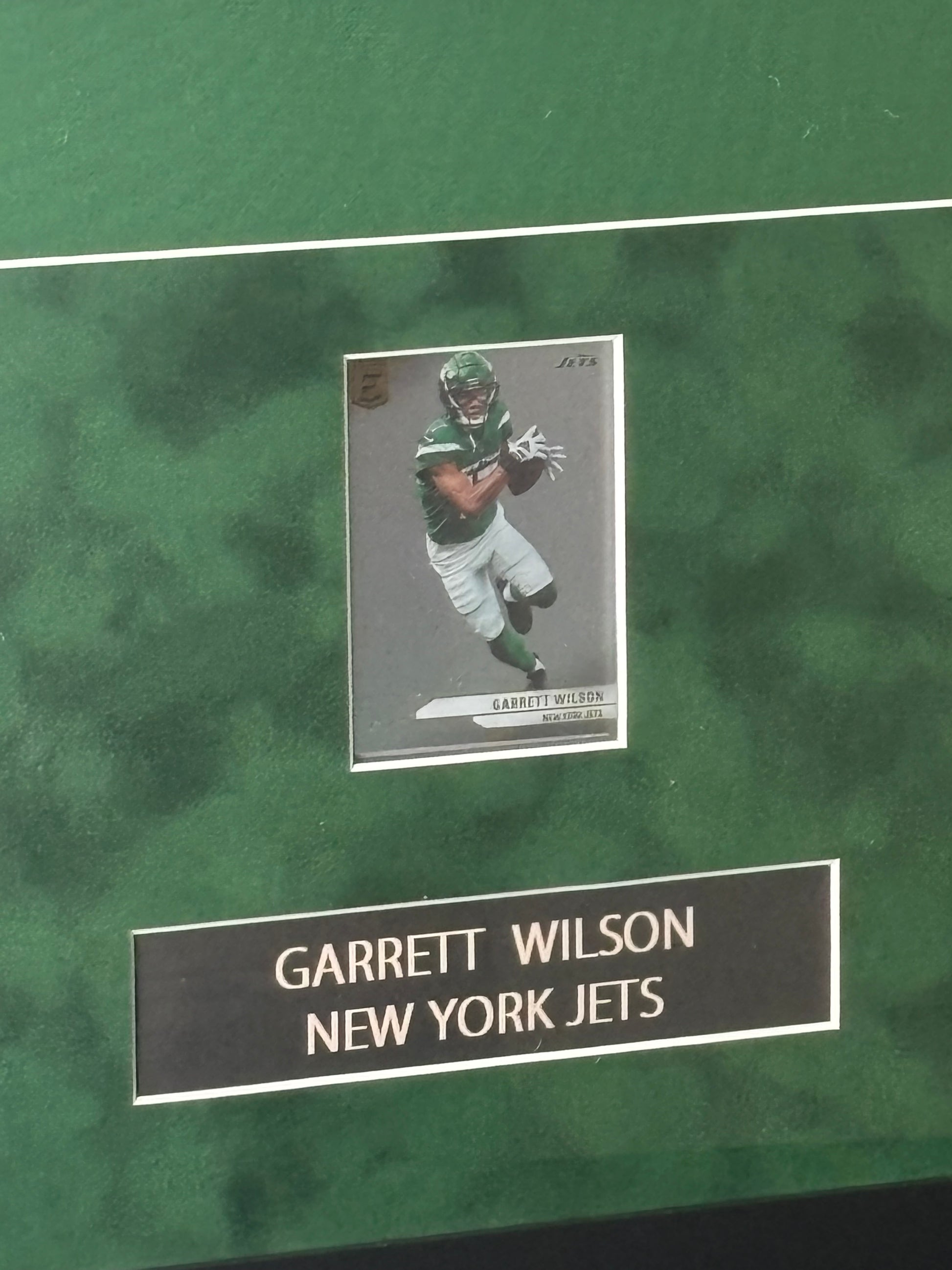 Framed Garrett Wilson Autographed N.Y. Jets Jersey w/ Fanatics Auth. & Sports Card
