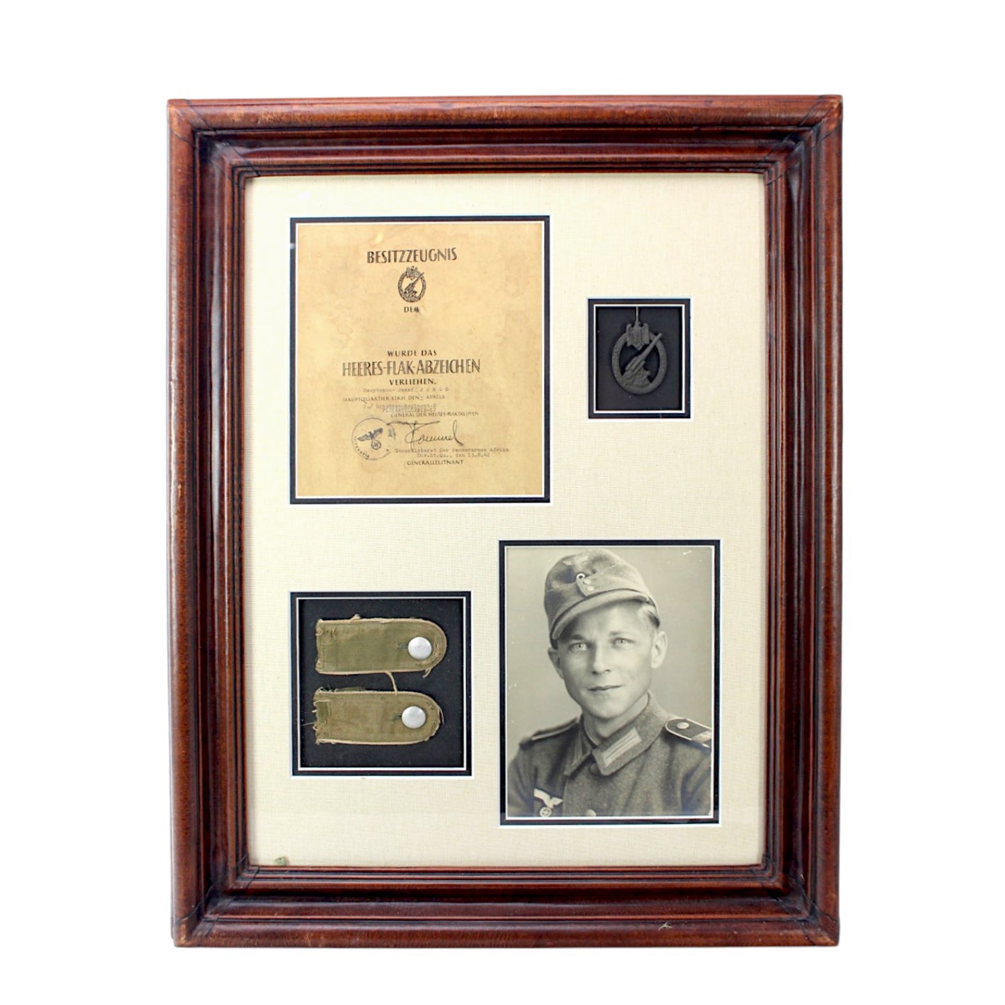 Afrika Korps German WW2 Collection with Rommel signed Order! – Collection includes a photo of the German Afrika Korps Soldier, (2) of his Afrika Korps Shoulder Boards Uniform removed, and Army Flak Badge with Rommel signed Award Document.