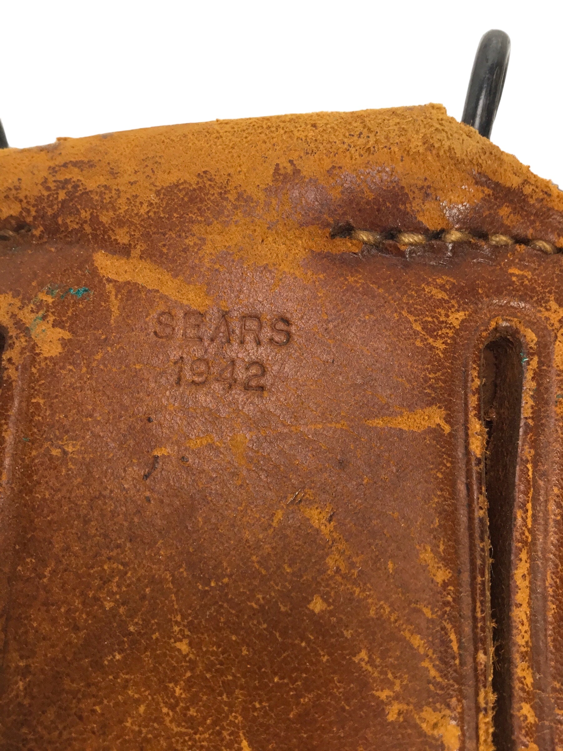 U.S. WWII leather pistol holster marked "U.S." on flap, further marked "Sears, 1942"